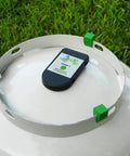 Propane Tank Gas Level Indicator With Bluetooth Magnetic Sensors mounted on LP tank in grassy area