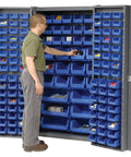 Heavy Duty Deep Door Bin Cabinet With 132 Blue Plastic Parts Organizers For Warehouse And Mobile Garage Setup featuring smooth swing doors and organized bins.