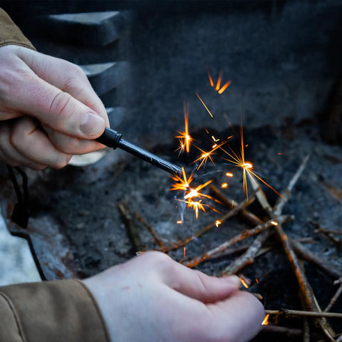 Sparks flying from Ceramic Striker Ferro Rod Fire Starter Kit With Zirconia Stone For Emergency Survival, lightweight outdoor use.