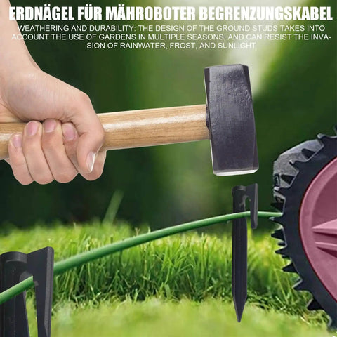 Heavy Duty Boundary Wire Pegs Straight Up Durable Portable Cable Stakes For Yard Setup shown with hammer and grass.