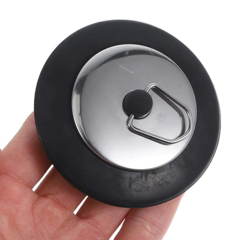Rubber Bathtub Drain Stopper Plug with Stainless Steel Seal held in hand, showcasing its rubber and stainless steel materials.