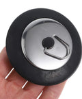 Stainless Steel Seal Rubber Bathtub Drain Plug for Bathrooms held in hand, featuring a sturdy black rubber base and shiny stainless steel top.