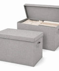 Premium Foldable Fabric Storage Bins With Tight Lids Double Pack Gray Cubes Cotton Linen Blend Organizer Boxes stacked with clothes.