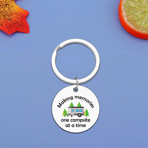 Camper Keychain Gift For RV Lovers And Campers, Travel Trailer Accessory with engraved camper design on blue background.