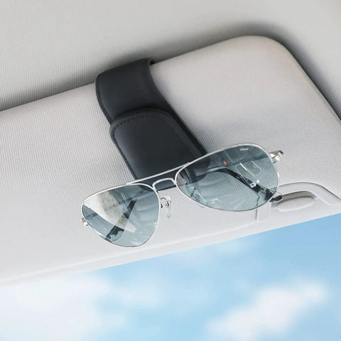 Heavy Duty Magnetic Sunglass Holder For Car Sun Visor With Secure Snap Clip And Soft Leather Wrap One Handed Eyewear Organizer on visor with sunglasses.