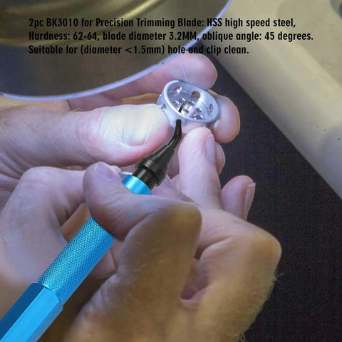 Close-up of a deburring tool from a 7 Piece Burr Busting Deburring Tool Set with metal handle, used on a small metal part.