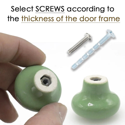 Hand holding one of the 10 Pack Green Ceramic Cabinet Knobs 32mm Round Drawer Pulls With Screws For Kitchen Cabinets Wardrobes Kids Rooms Bedrooms And Office Desks Makeover Ready, with screws in background