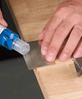 Applying lapping fluid on All In One Credit Card Diamond Sharpening Kit With 180 300 Grit And 600 1000 Grit Stones to sharpen blade