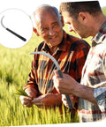 Two men using Five Piece Rustproof Garden Sickle Set For Weeding And Harvesting With Comfortable Grip Handles in a wheat field.