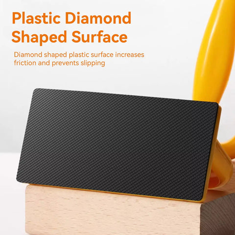 Close-up of a 2 Pack Push Blocks for Table Saws and Woodworking Angled Handle Push Sticks with diamond-shaped plastic surface