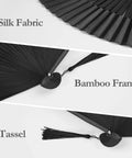 Close-up details of Black Hand Fan For Stage And Rave Dancers With Elaborate Design And Satisfying Snap Clack showing silk, bamboo, tassel.