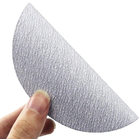 Top Notch 9 Inch Sanding Discs 100 Pack Wet Dry Alumina Paper 60 To 1000 Grit Set for wood metal projects shown in hand.