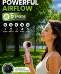 Person using Rechargeable Handheld USB Fan With 5 Speeds For On The Go Personal Cooling Breeze Foldable Battery Operated Travel Fan