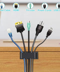 Large Cable Management Clips For Under Desk Cable Organization No Mess Wire Clips securing various cables on desk.