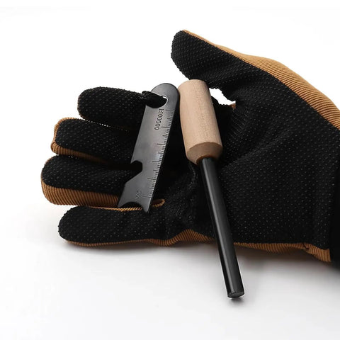 Gloved hand holding 4 Pack Five Sixteenth Inch Ferro Rod Fire Starter with wood handle and multi-tool striker