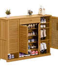 Spacious Six Tier Freestanding Shoe Cabinet Boasting Four Doors And A Nifty Drawer To Stow Away Your Best Kickers In Style displayed with shoes organized inside.