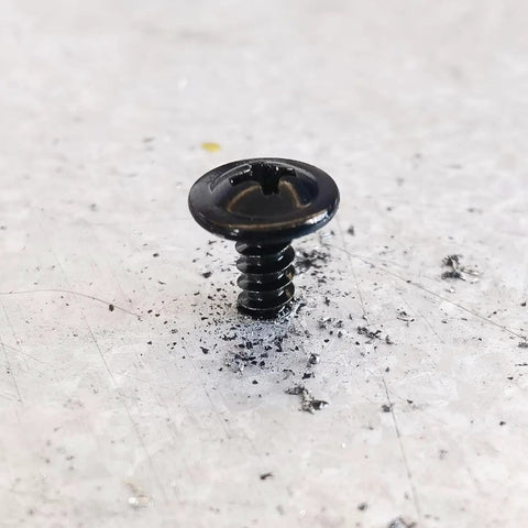 Top Shelf Black Truss Head Self Tapping Screw Kit With Assorted Lengths Half Inch To Two Inches Built Like A Tank From 410 Stainless Steel, black self-tapping screw on a surface.