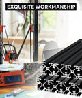 Four Pack 4040 T Slot Aluminum Extrusion Profiles In Anodized Black For European Standard Framing And Linear Motion Guide Rails Perfect For 3D Printers DIY Projects And Automation Equipment next to a 3D printer.