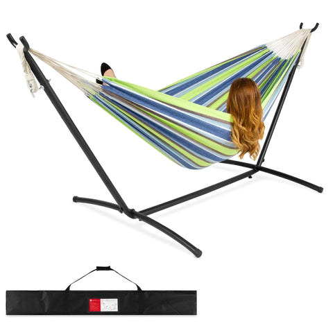 Two Person Indoor Outdoor Hammock With Steel Stand Cozy Brazilian Gathered End Style Cotton Bed For A Cocoon Vibe Carrying Bag Included Blue Green Stripes with person lounging