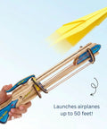 Paper Airplane Launcher STEM Kit For Kids Teens And Adults A Hands On Engineering Project That Lets You Build A Wooden Launcher In About 60 Minutes And Fly Custom Planes While Learning Science, wooden launcher in hand launching yellow paper plane