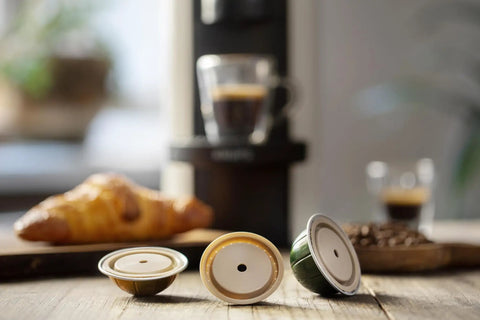 Reusable Silicone Capsule Cap For Nespresso Vertuo And VertuoLine Refills Made Easy Mess Free Compatible And Food Grade Italian Made Quality Pack Of 2 Caps Easy To Clean on table with espresso and croissant