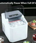 Snap This Ultra Fast Countertop Ice Maker Onto Any Shelf And Pull Out Chilled Bullet Cubes In Minutes with a transparent lid and ice.