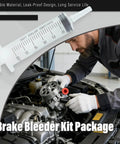 Mechanic using Brake Bleeder Kit For Cars And Motorbikes With 1L Bleeder Bottle 2 One Way Check Valves 60ml Syringe tool