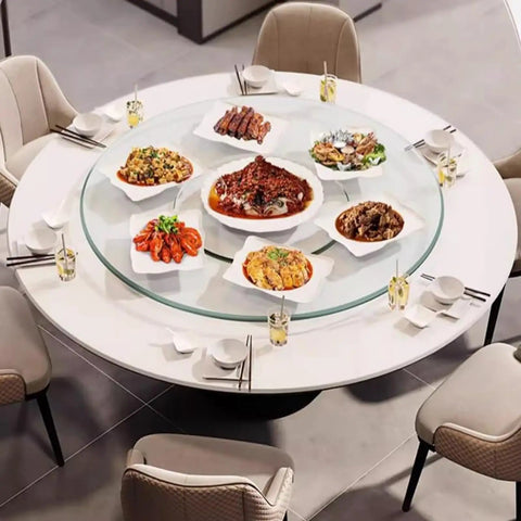 Massive 47 Inch Clear Tempered Glass Lazy Susan Turntable With Killer Smooth Swivel Rotation displaying meals on a dining table.