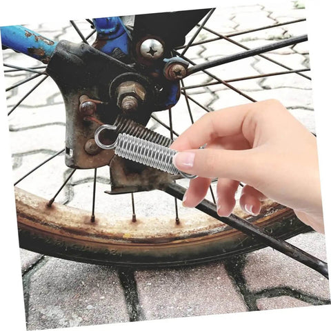 Get Your Fix With This Awesome 8 Pcs Small Tension Spring Kit Offering Heavy Duty Compression And Extension Springs Perfect For Ev Parking Stands, Ladder Feet, And Various Diy Mechanical Projects That Need Reliable Elasticity And Easy Installation Every. stainless steel tension spring on bike wheel hub, held by hand
