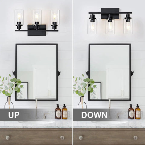 Top Shelf Matte Black Three Light Bathroom Vanity Fixtures With Clear Glass Shades Knockout Modern Farmhouse Wall Sconces mounted above and beside mirror.