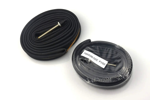 Rolled 700c 28 to 32c bike inner tubes with 60mm Presta valve, premium butyl rubber close-up, part of a 6 pack.