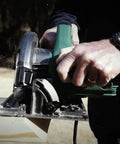 7 1 Quarter Inch Circular Saw Kit Pro Grade With 6000 RPM 15 Amp Motor Integrated Dust Blower 24 Tooth Framing And Ripping Blade Single Handed Bevel Adjustment Includes Carrying Bag And Hex Wrench in use cutting wood