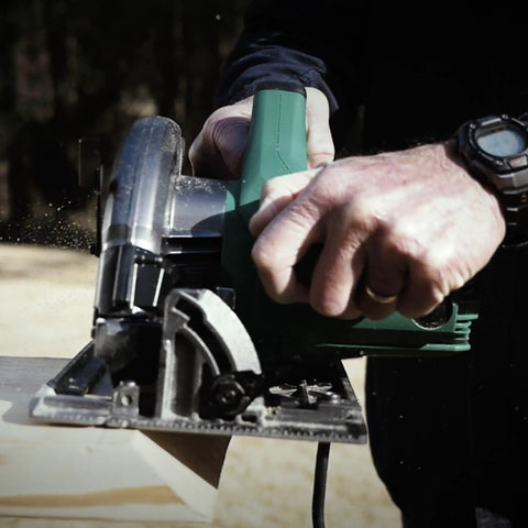 7 1 Quarter Inch Circular Saw Kit Pro Grade With 6000 RPM 15 Amp Motor Integrated Dust Blower 24 Tooth Framing And Ripping Blade Single Handed Bevel Adjustment Includes Carrying Bag And Hex Wrench in use cutting wood
