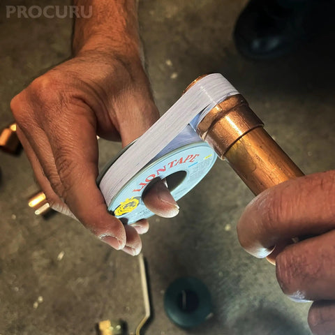 Person wrapping pipe with Liontape G701 Heavy Duty PTFE Teflon Pipe Thread Sealant Tape Half Inch By Twelve Hundred Inches 4 Mil Thick 100 Ft Leak Proof Water Oil Gas Up To 12000 PSI Grey