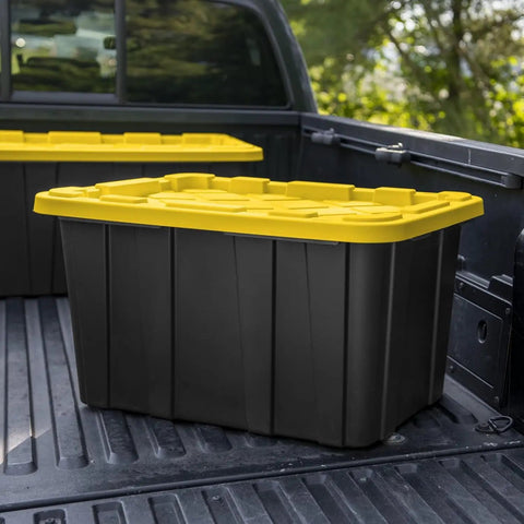 Six Pack Heavy Duty Stackable Industrial Totes Top Shelf Plastic Storage Bins With Secure Snap Lids Rock Solid Build For Garage Workshop And Warehouse Organization Black And Yellow in a truck bed.