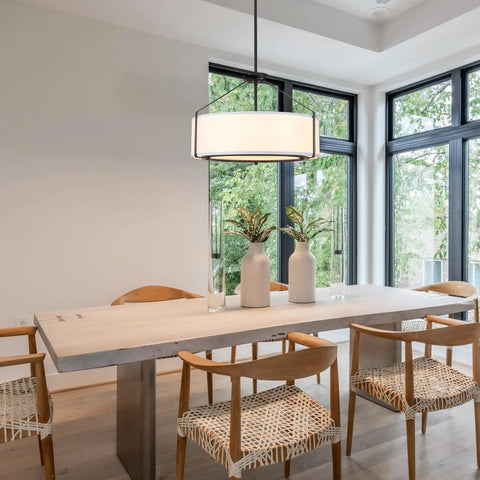 Grab This 20 Inch Drum Chandelier With 5 Lights For Instant Modern Farmhouse Vibes Featuring Soft White Linen Shades And Sleek Black Frames, illuminating a dining table.