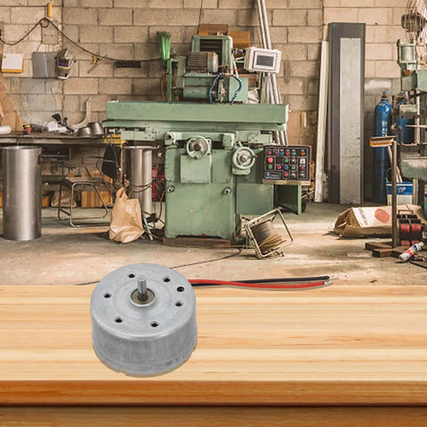 High Output Dc Motor Running 1.5 To 6V Kicking Out A Clean 9000 Rpm Inside A Sleek 24Mm Round Metal Casing Backed By A Beefy 2Mm Precision Shaft on wooden table in workshop.