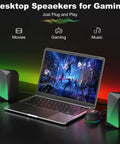 Bluetooth Computer Speakers With USB Power And 3.5mm AUX next to laptop showing gaming scene, with LED flame lights