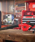 V20 Cordless Leaf Blower Bare Tool with 125 MPH Max Air, 3 Speed Selector on a workbench in a garage.