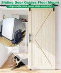 Three Roller Adjustable Floor Guide Kit For Double Bypass Sliding Doors Black Floor Mount Guides installed on barn doors.