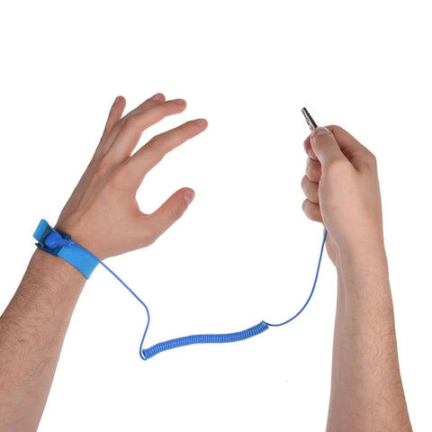 Ground Yourself While Working On Sensitive Electronics With A 3 Pack Of Reusable Anti Static Wrist Straps With Grounding Wire And Alligator Clip For Maximum ESD Protection When Installing RAM Or Graphics Cards On Your PC Includes Two Black And One Blue shown on wrist and hand holding clip.