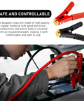 Heavy Duty Insulated Alligator Clips For Battery Jumper Cables High Amp Crocodile Clamps used on a battery with a person connecting them.