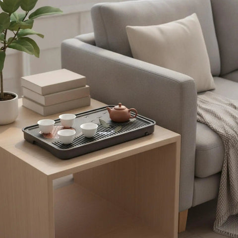 Zero Drip Drama Gongfu Tea Station Serving Tray With Imitation Ebony Stone Finish And Smart Catch Basin Design Keeping Your Living Room Setup Totally Stress Free All Day on wooden table with teapot and cups.
