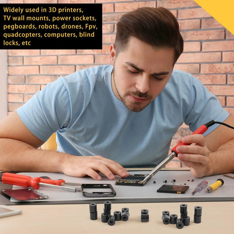 Man using 200 Pcs Black Nylon Spacers Half Inch Thick, Half Inch Outer Diameter, 0.194 Inch Inner Diameter for electronics.