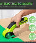 Built Different Cordless Electric Scissors With Brushless Motor And Fast Type C Charging For Heavy Duty Cardboard Box Cutting And Smooth Fabric Trimming Featuring Rock Solid Sk5 Blades, cutting green fabric on a wooden surface.