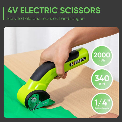 Built Different Cordless Electric Scissors With Brushless Motor And Fast Type C Charging For Heavy Duty Cardboard Box Cutting And Smooth Fabric Trimming Featuring Rock Solid Sk5 Blades, cutting green fabric on a wooden surface.