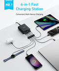 Six Port USB C Fast Charger Dock With 112W Max charging multiple devices including laptops and phones on a desk setup.