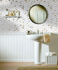 Bathroom with Hexagon Peel And Stick Tile Backsplash Kit With White Marble Look And Gold Metal Accents behind pedestal sink.