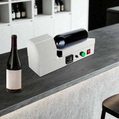 Compact Electric Heat Shrinking Machine For Pvc Bottle Sleeves And Wine Caps on a countertop with a wine bottle.