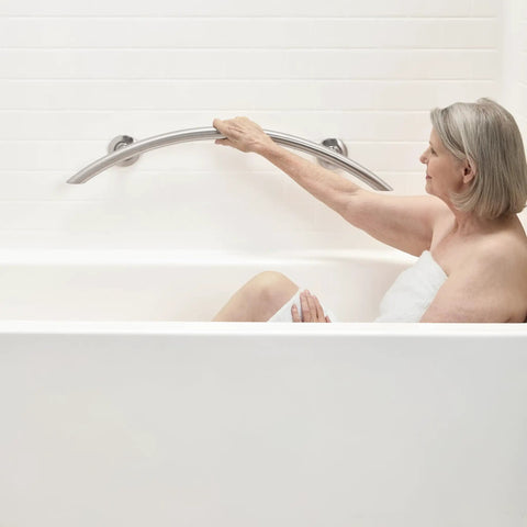 30 Inch Crescent Curved Shower Grab Bar Built Tough In Polished 304 Stainless Steel One Piece Welded Cap 250 Pound Weight Capacity Includes Mounting Screws For Easy Install, woman using in bathtub